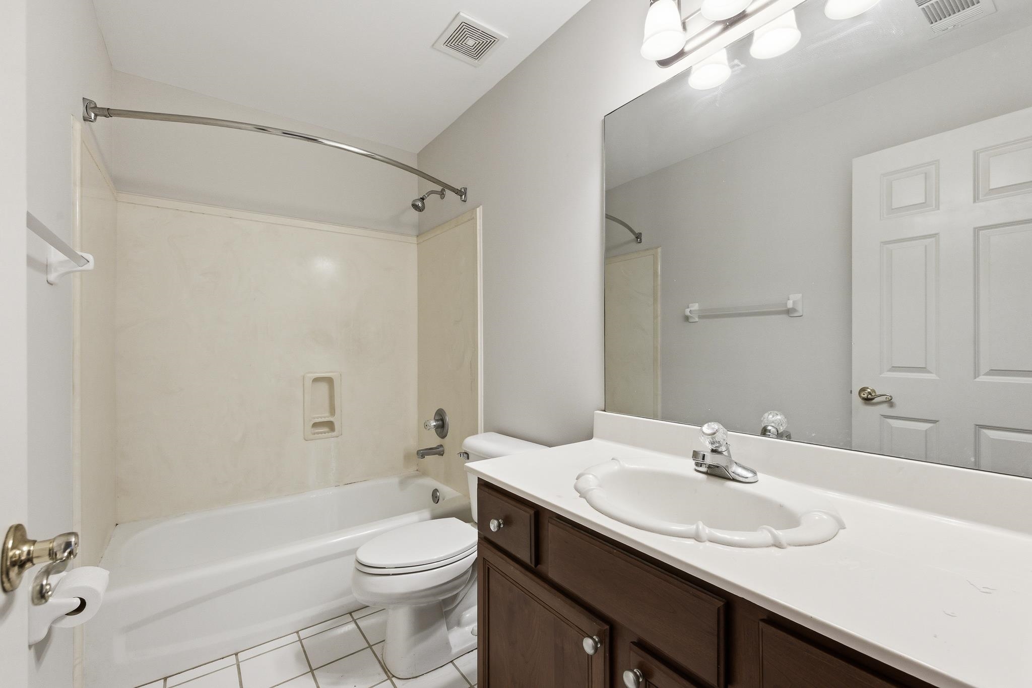 1348 Colbert Cove Collierville, TN 38017 - Photo 24 of 34 a bathroom with a sink a toilet and shower