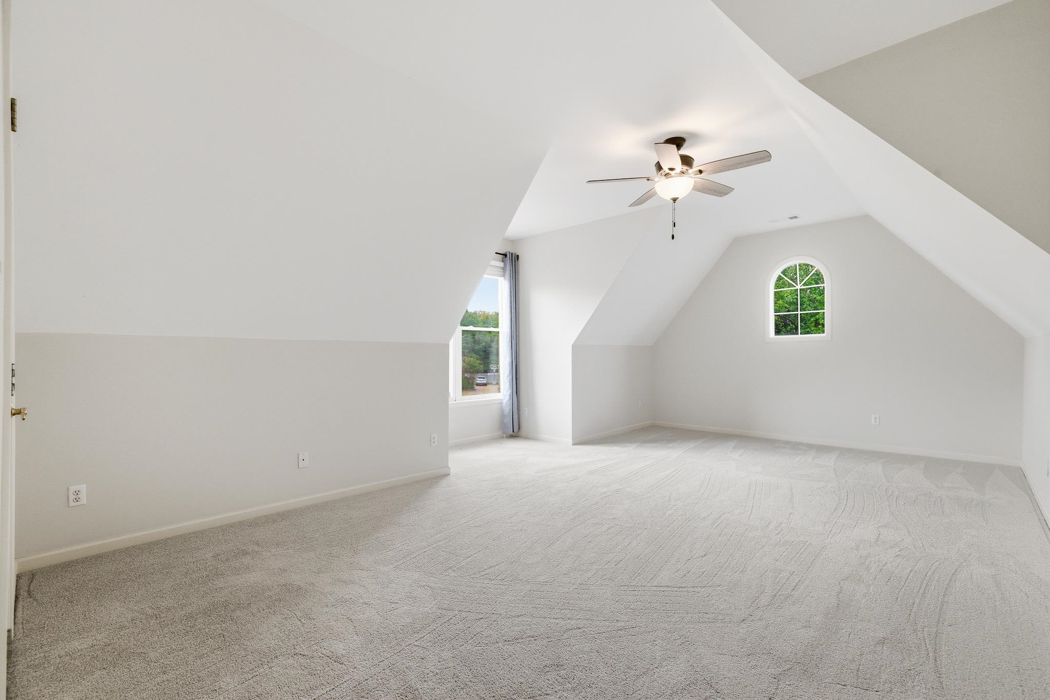1348 Colbert Cove Collierville, TN 38017 - Photo 25 of 34 a view of a big room with chandelier fan and windows