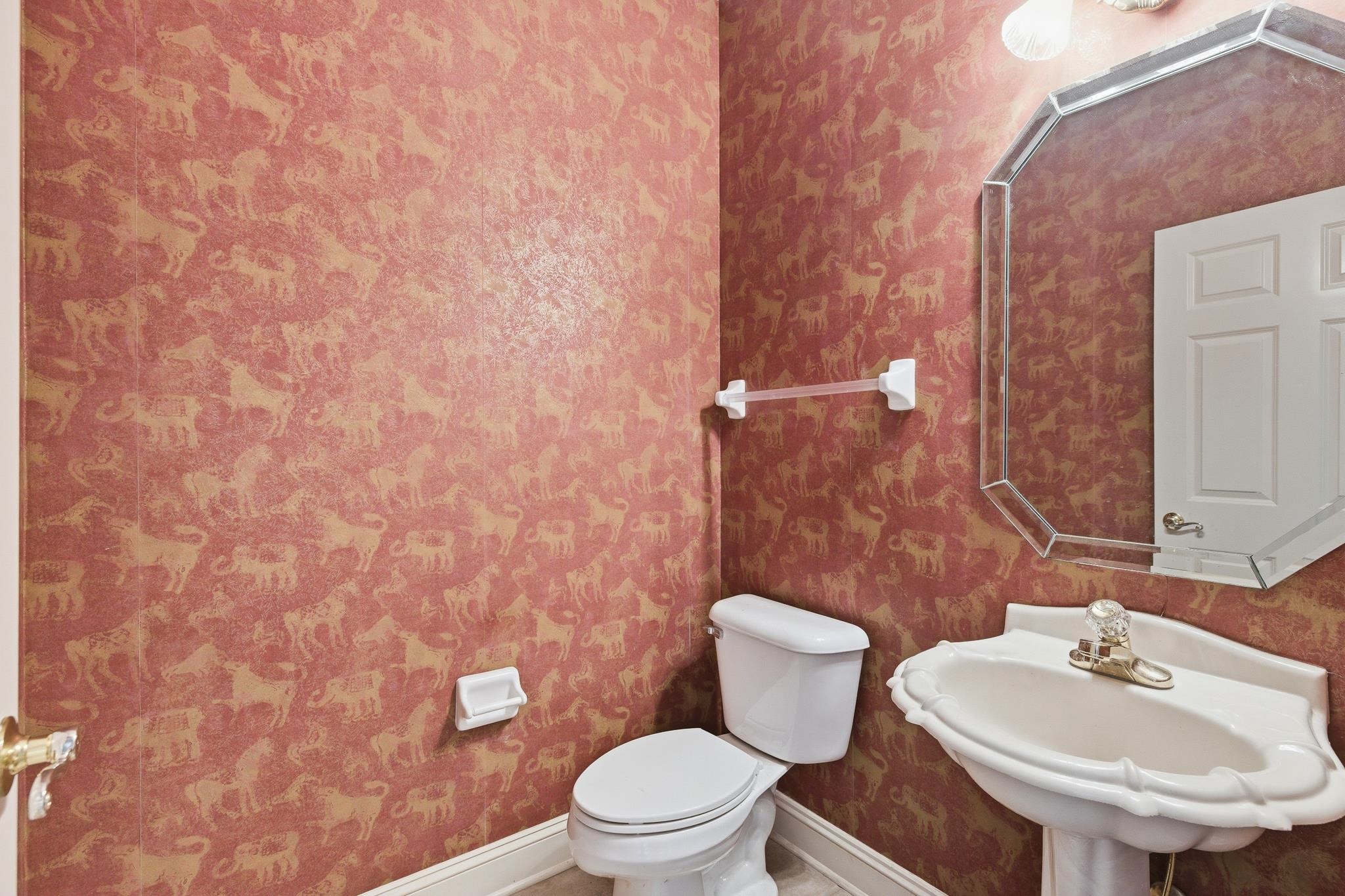 1348 Colbert Cove Collierville, TN 38017 - Photo 28 of 34 a bathroom with a sink a toilet and a mirror