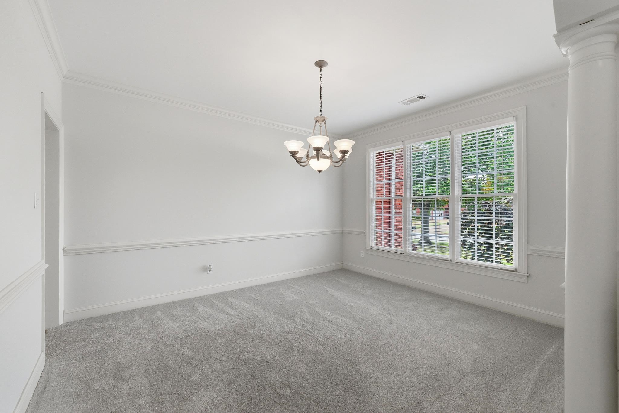 1348 Colbert Cove Collierville, TN 38017 - Photo 5 of 34 a view of wooden floor and windows in a room