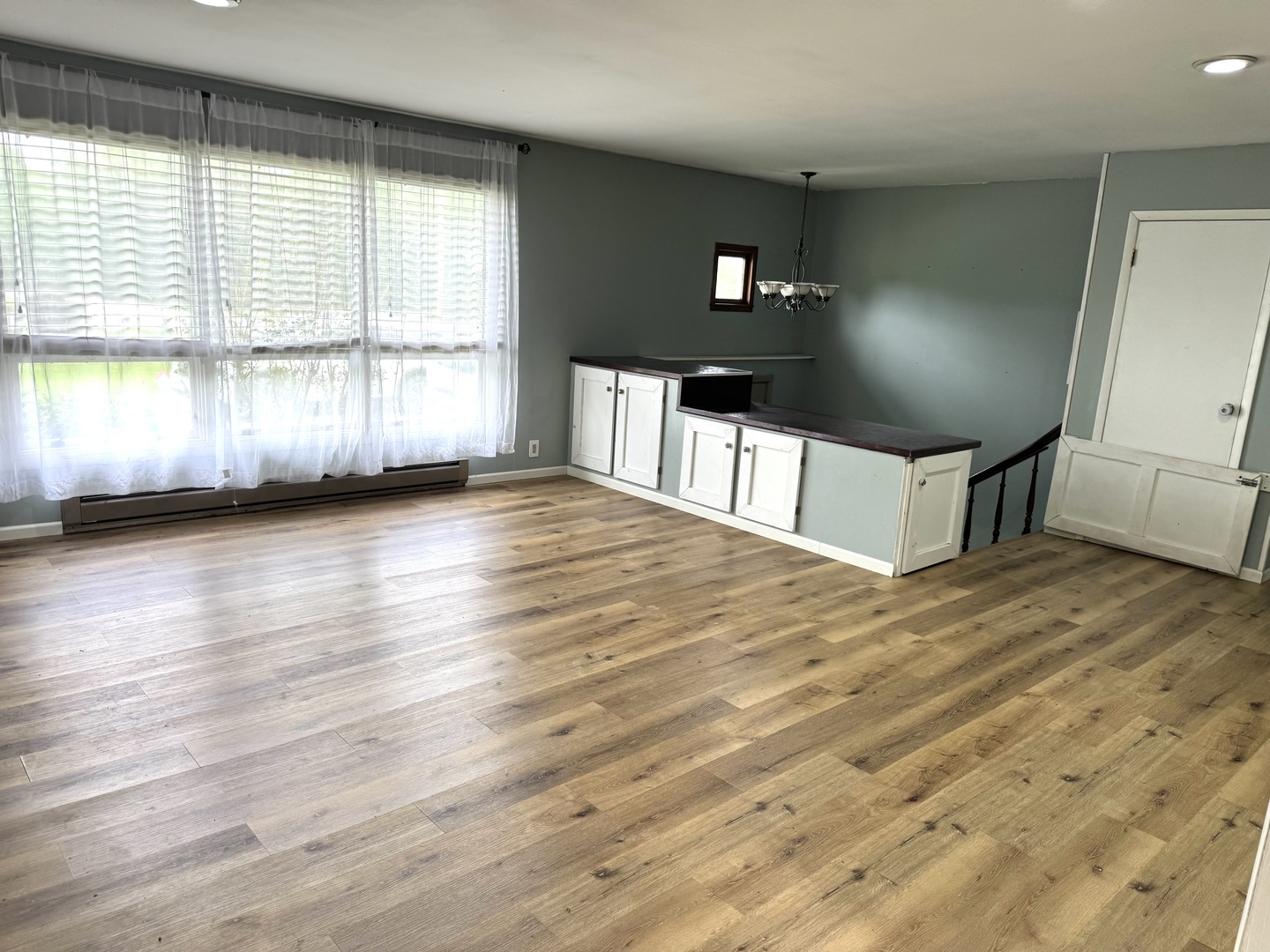 2884 Tick Ridge Road Grand Chain, IL 62941 - Photo 13 of 35 a view of an empty room with wooden floor and a window
