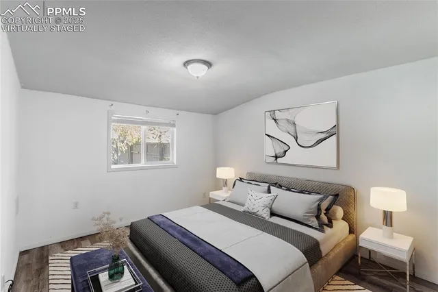 a bedroom with bed and a window