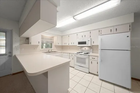 a bedroom with a bed and cabinets