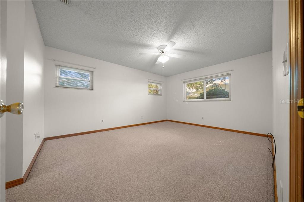 8431 Southwest 93rd Place, Unit A Ocala, FL 34481 - Photo 29 of 56 an empty room with a window