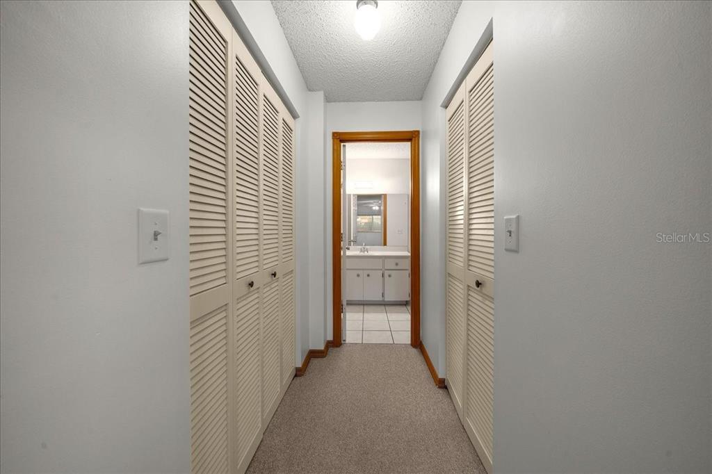8431 Southwest 93rd Place, Unit A Ocala, FL 34481 - Photo 31 of 56 a view of a hallway with a white walls