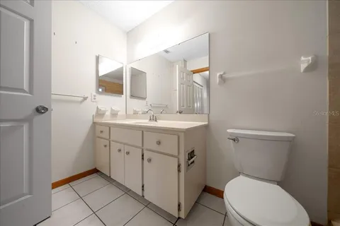 a bathroom with a toilet and shower
