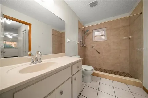 a view of a bathroom with a glass door
