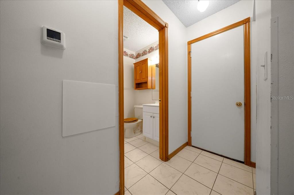 8431 Southwest 93rd Place, Unit A Ocala, FL 34481 - Photo 38 of 56 a view of a bathroom with a glass door