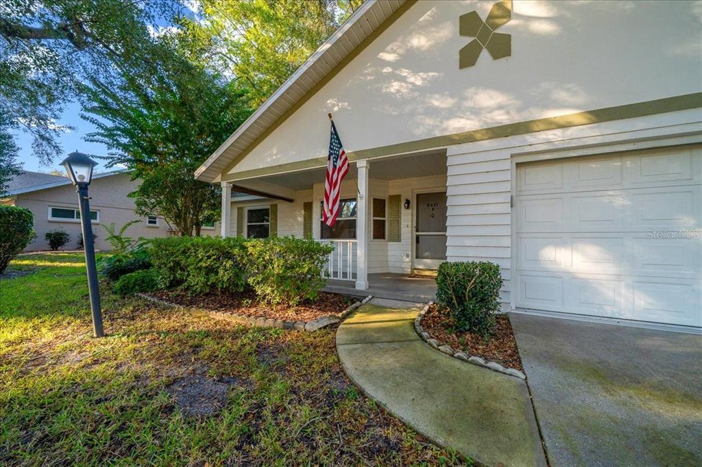 8431 Southwest 93rd Place, Unit A Ocala, FL 34481 - Photo 56 of 56 a view of a house with a yard
