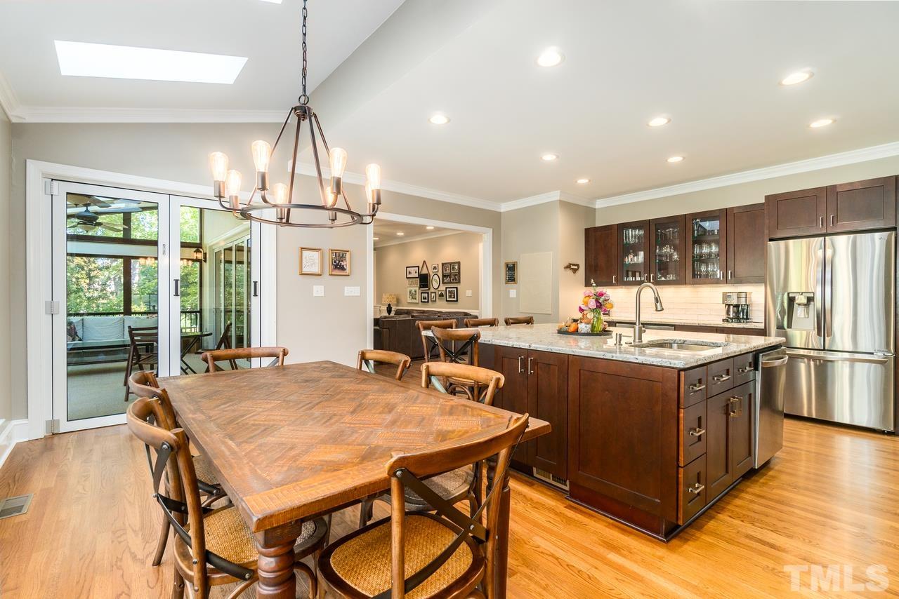 9200 Ranworth Way Raleigh, NC 27615 - Photo 12 of 39 The large island in this kitchen provides for lots of storage options.