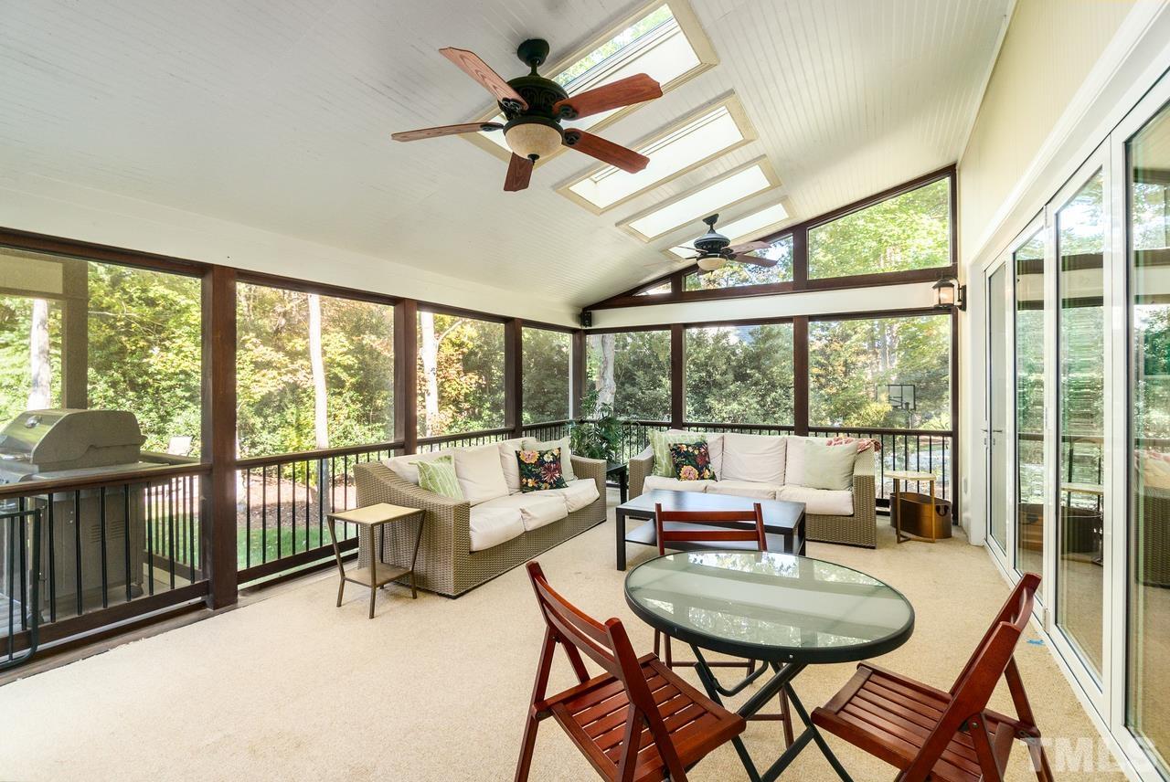 9200 Ranworth Way Raleigh, NC 27615 - Photo 18 of 39 Screened in porch located accessible directly from both the kitchen and the family room. Feature four skylights and two ceiling fans.