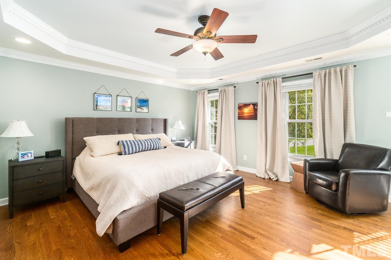 9200 Ranworth Way Raleigh, NC 27615 - Photo 19 of 39 This master bedroom has a tray ceiling, hardwood floors, and a sitting area with a vaulted ceiling that could easily provide for an office.