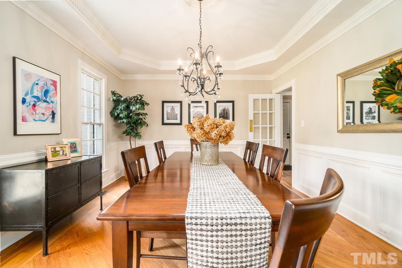 9200 Ranworth Way Raleigh, NC 27615 - Photo 7 of 39 This dining room comes with a tray ceiling and wainscoting.