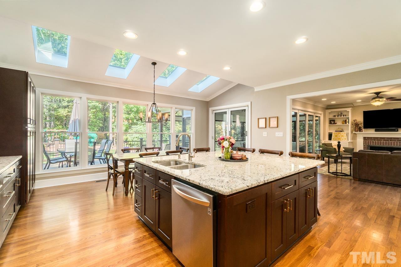 9200 Ranworth Way Raleigh, NC 27615 - Photo 10 of 39 Kitchen has an breakfast nook and features four skylights that provide tons of natural light.