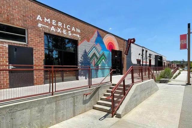 a view of a balcony with floor to ceiling windows and living room