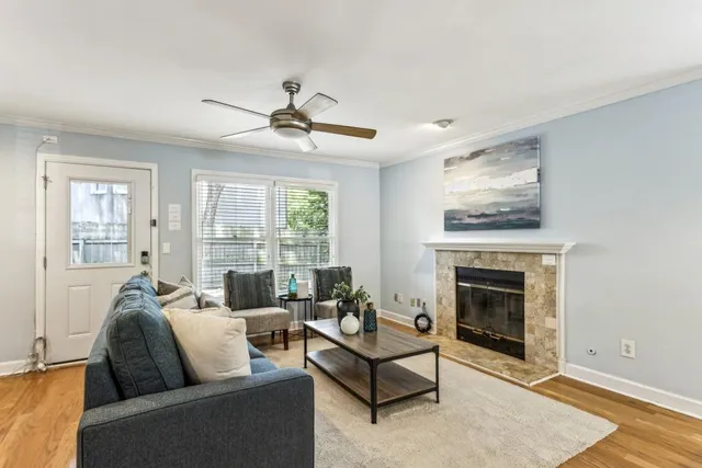 a living room with furniture and a fireplace