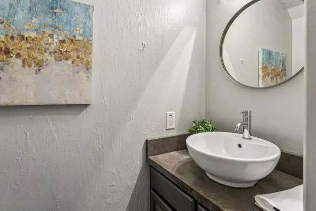 a bathroom with a sink and a mirror