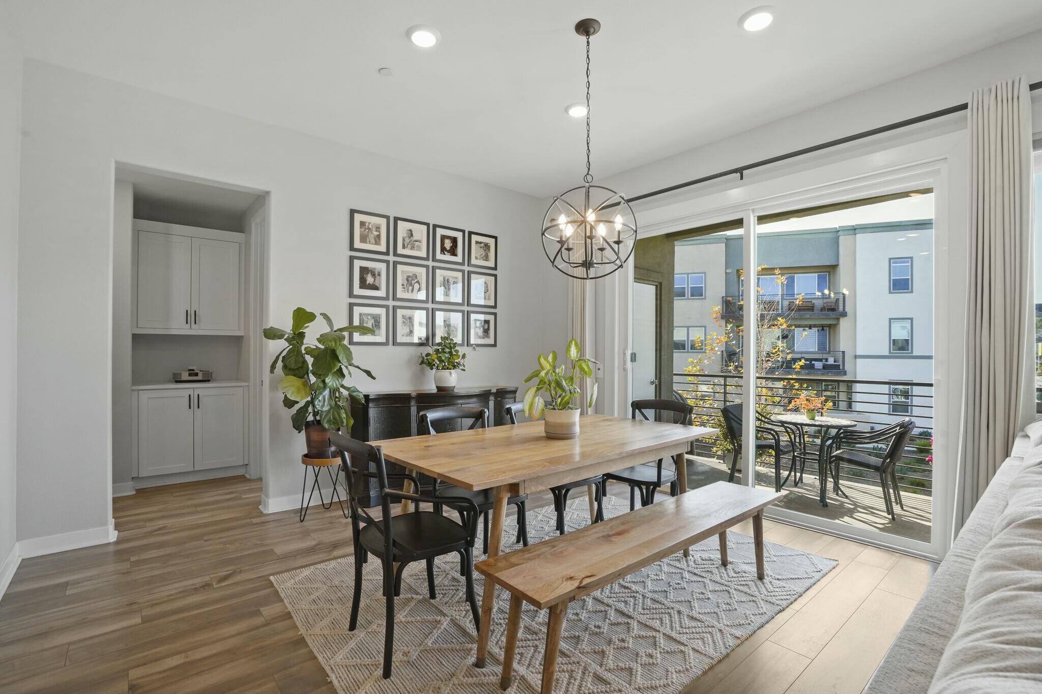 26976 West Prospector Road, Unit 205 Valencia, CA 91381 - Photo 12 of 31 a view of a dining room with furniture window and wooden floor