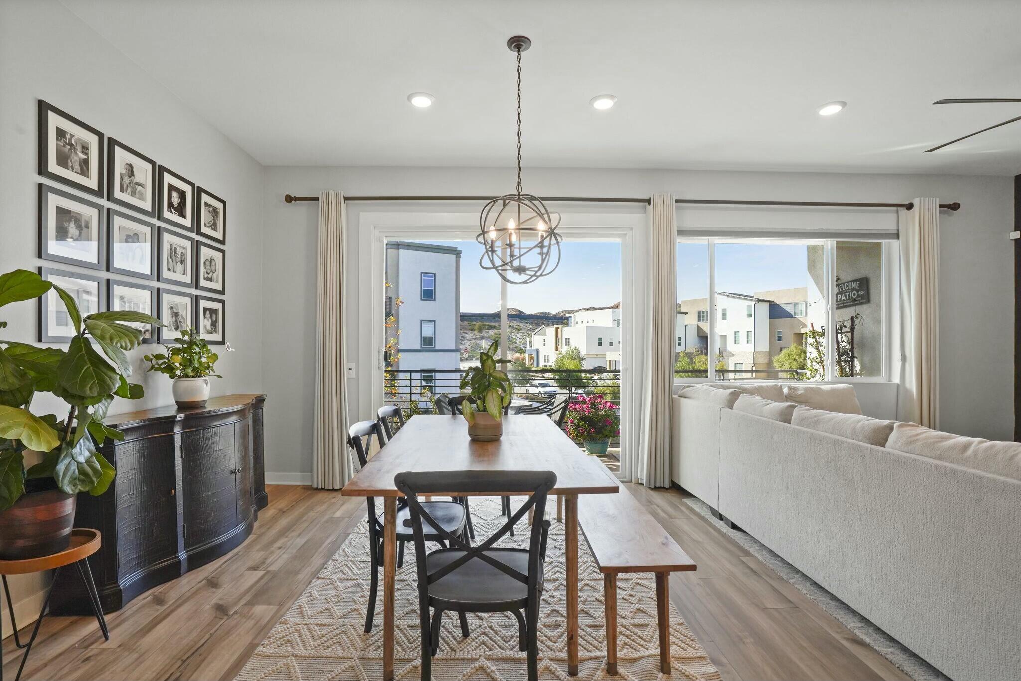 26976 West Prospector Road, Unit 205 Valencia, CA 91381 - Photo 13 of 31 a view of a dining room with furniture window and wooden floor