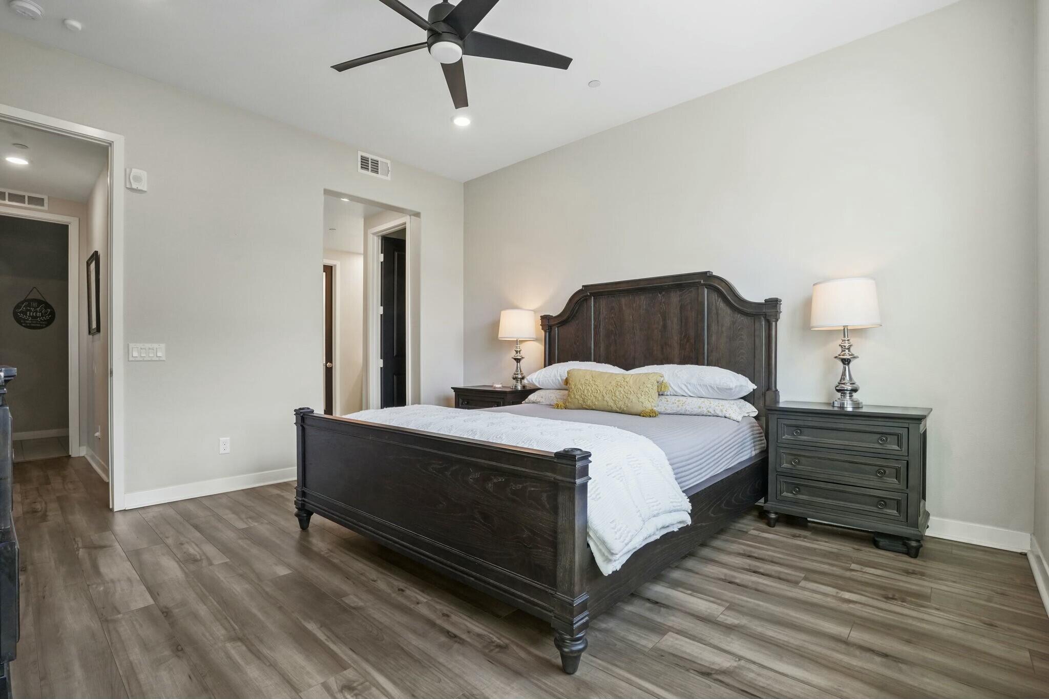 26976 West Prospector Road, Unit 205 Valencia, CA 91381 - Photo 15 of 31 a bed room with a bed and a ceiling fan