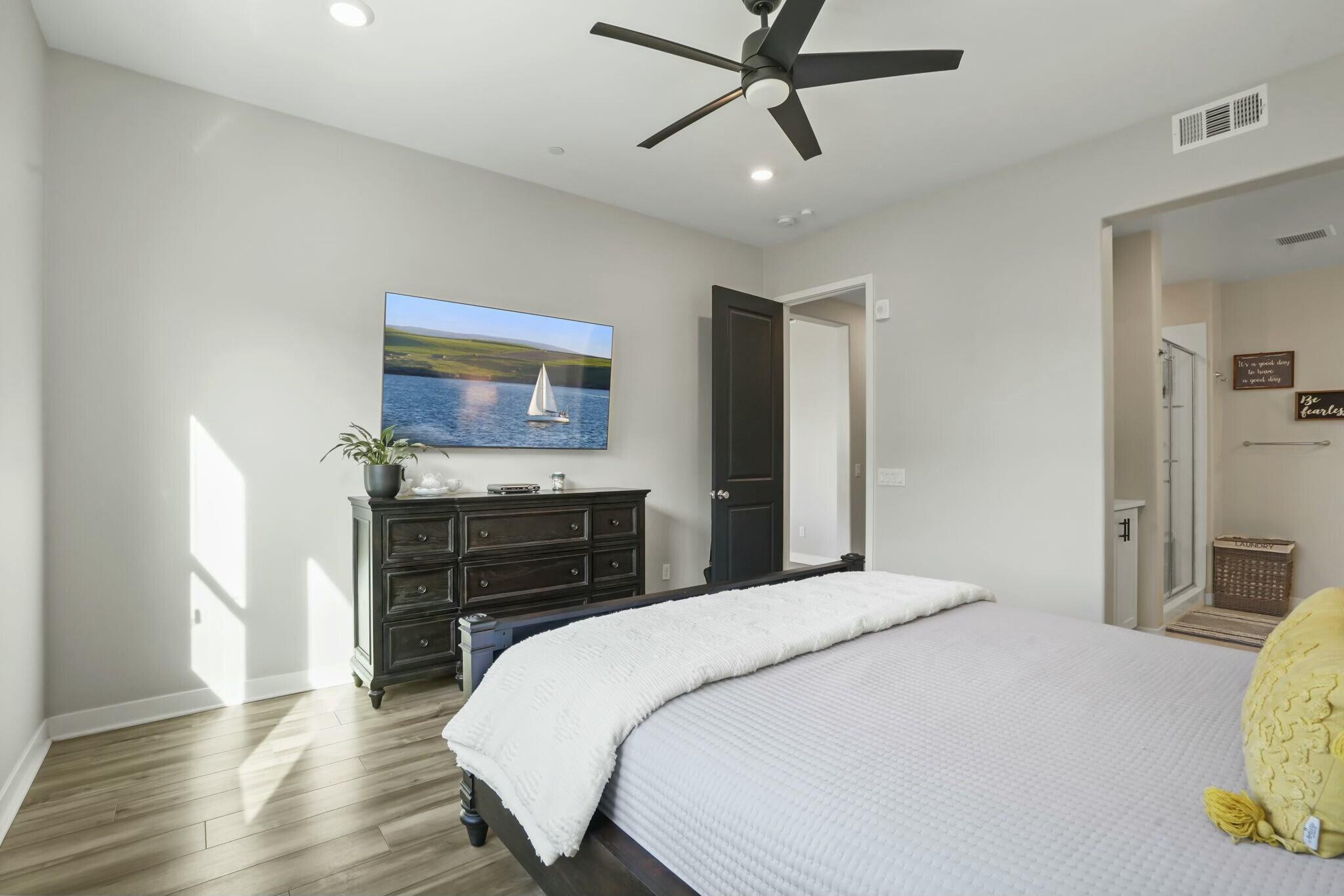 26976 West Prospector Road, Unit 205 Valencia, CA 91381 - Photo 16 of 31 a bedroom with a bed and a flat screen tv