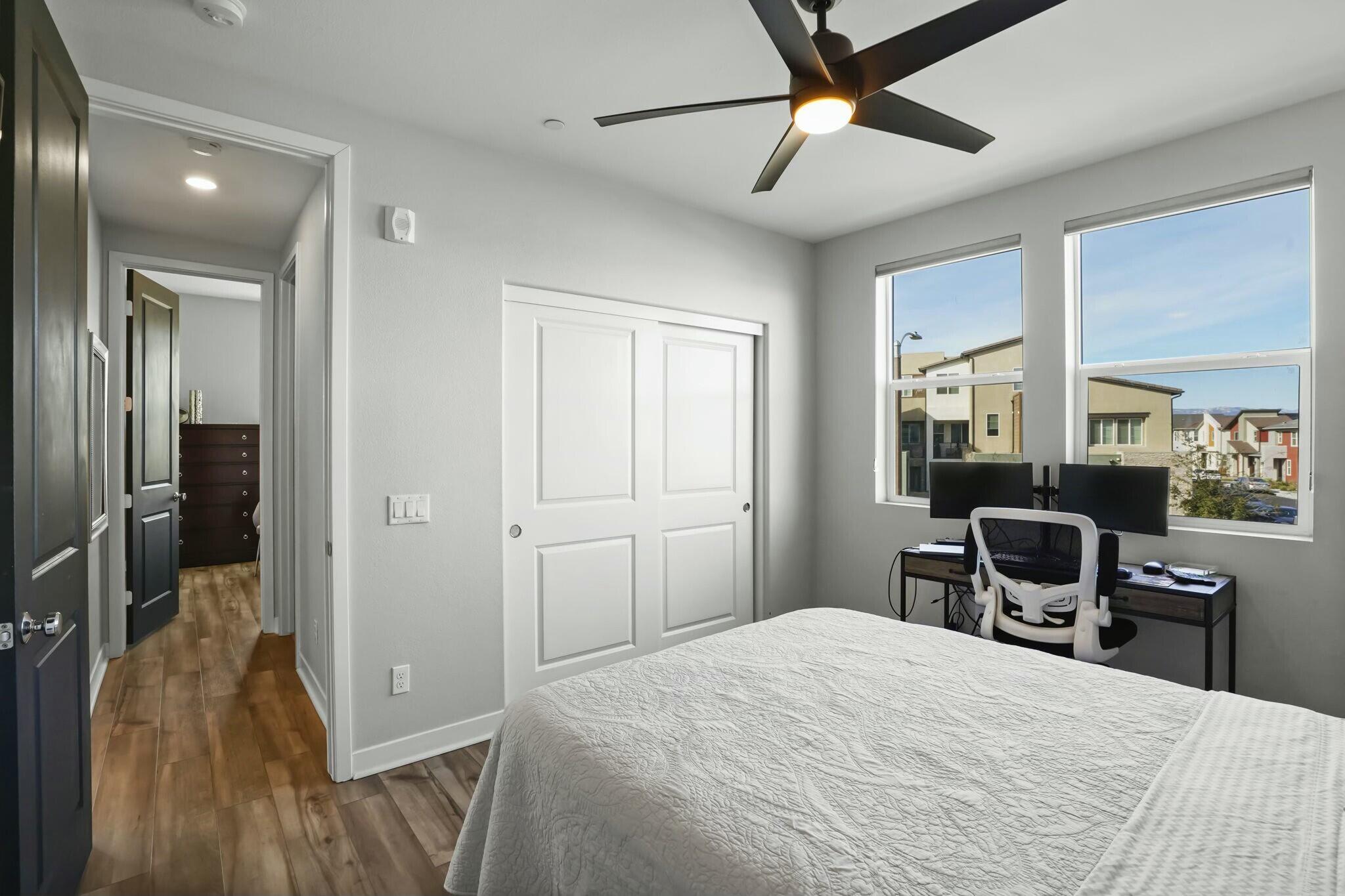 26976 West Prospector Road, Unit 205 Valencia, CA 91381 - Photo 21 of 31 a bedroom with a bed and a chandelier