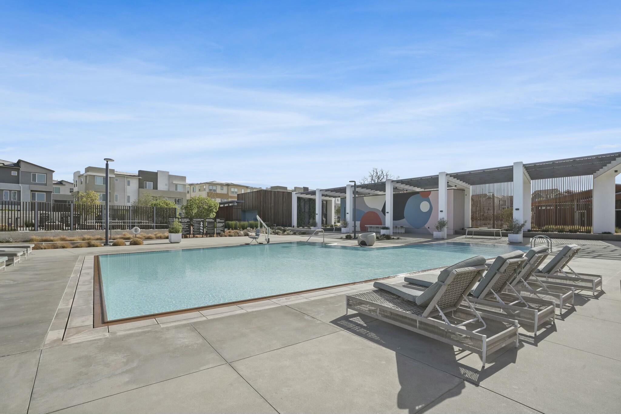 26976 West Prospector Road, Unit 205 Valencia, CA 91381 - Photo 30 of 31 a view of a city with lawn chairs