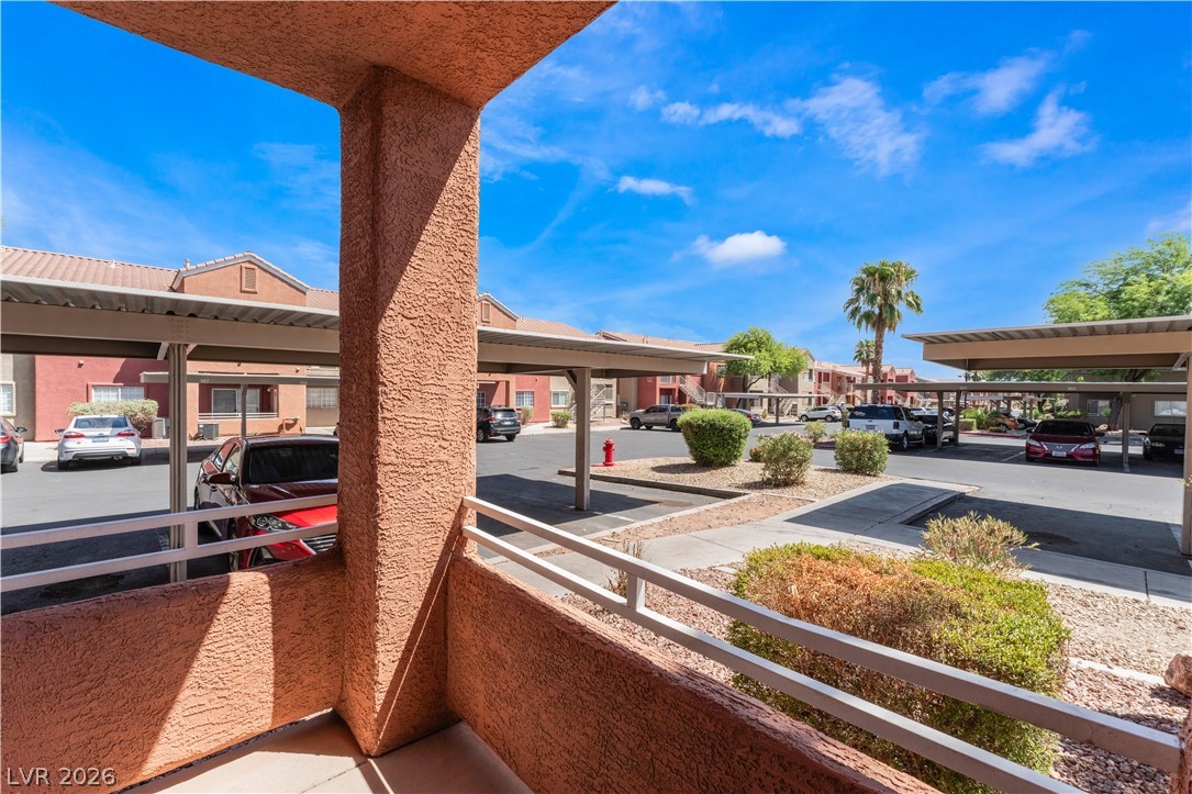 4730 East Craig Road, Unit 1058 Las Vegas, NV 89115 - Photo 27 of 30 An inviting view of the community's convenient covered parking spaces and mature landscaping.
