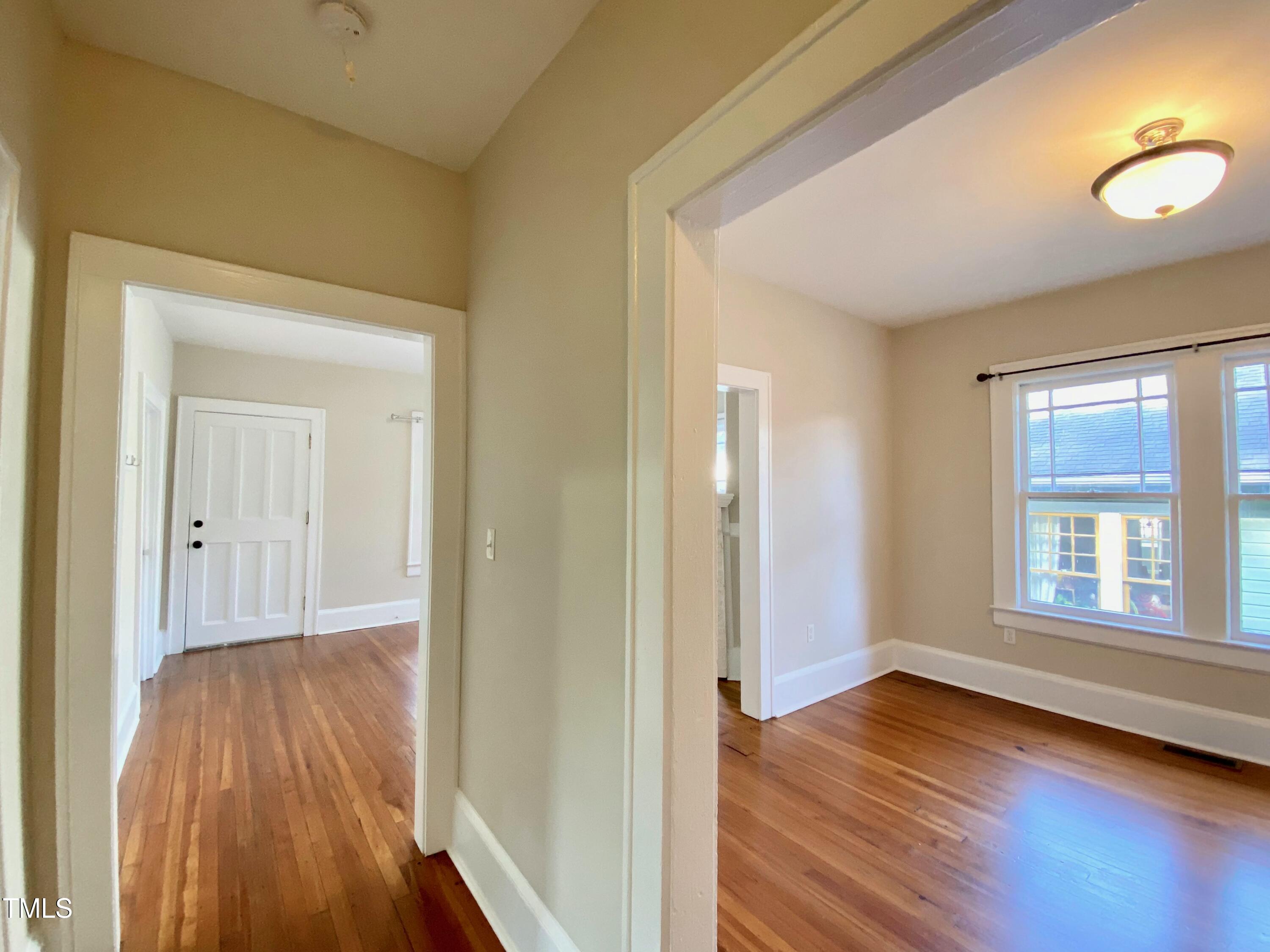 407 Ottawa Avenue Durham, NC 27701 - Photo 23 of 30 a view of a livingroom with wooden floor and window