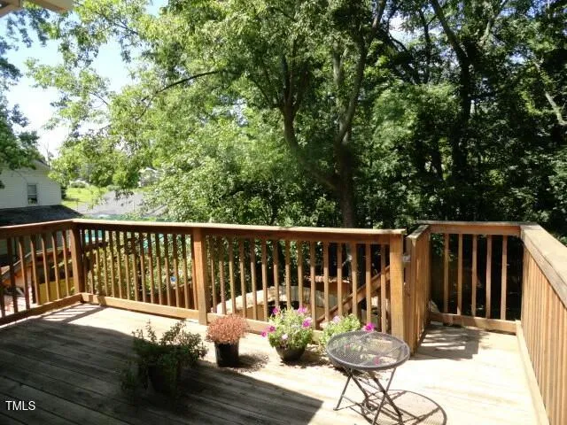 a view of a chair and table on the wooden floor