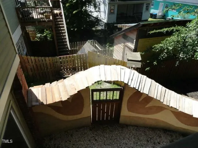 a view of stairs and a yard