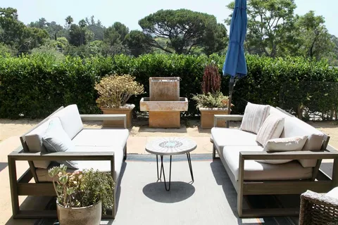 a outdoor living space with furniture and a potted plant