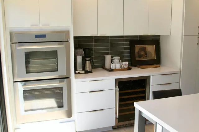 a kitchen with appliances and cabinets