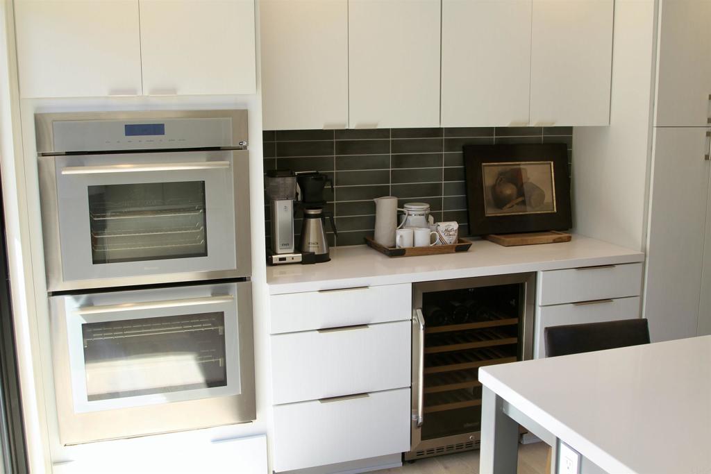 6173 Paseo Arbolado Rancho Santa Fe, CA 92067 - Photo 7 of 16 a kitchen with appliances and cabinets