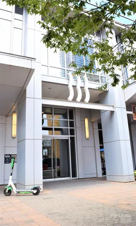 a view of a house with a tree