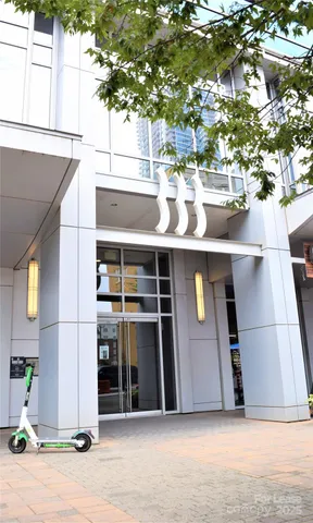 a view of a house with a tree