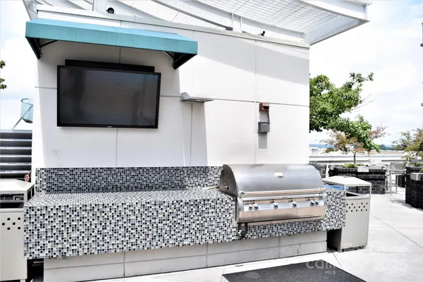 a outdoor living space with patio furniture and garden view