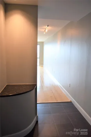 a kitchen with stainless steel appliances a microwave a sink and a refrigerator