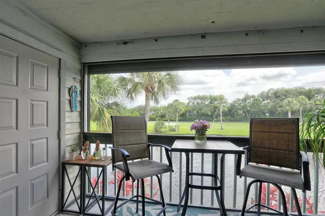 an aerial view of a house with yard swimming pool and outdoor seating