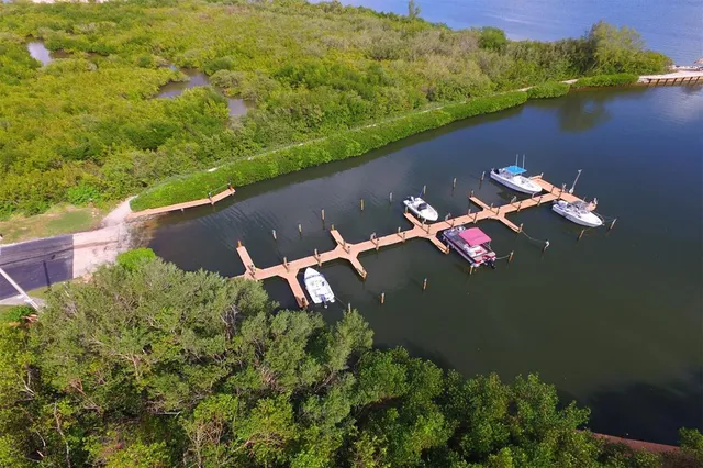 an aerial view of a house with yard