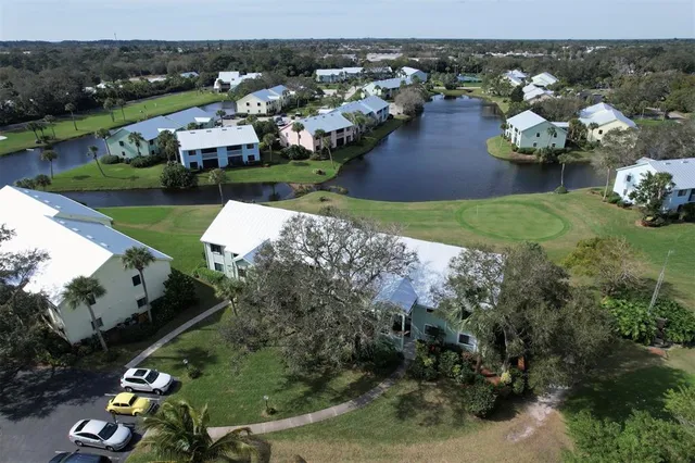 an aerial view of a residential houses with outdoor space