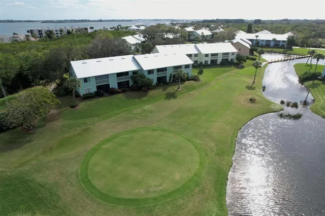 an aerial view of a residential houses with outdoor space