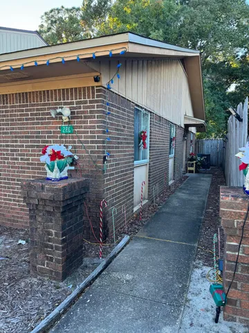 a side view of a house with a garage