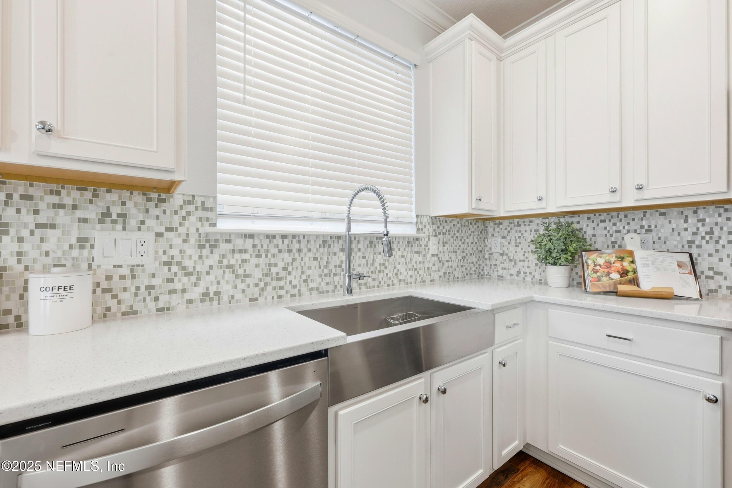 251 Rambling Brk Trail St. Johns, FL 32259 - Photo 15 of 40 a kitchen with granite countertop white cabinets and white appliances
