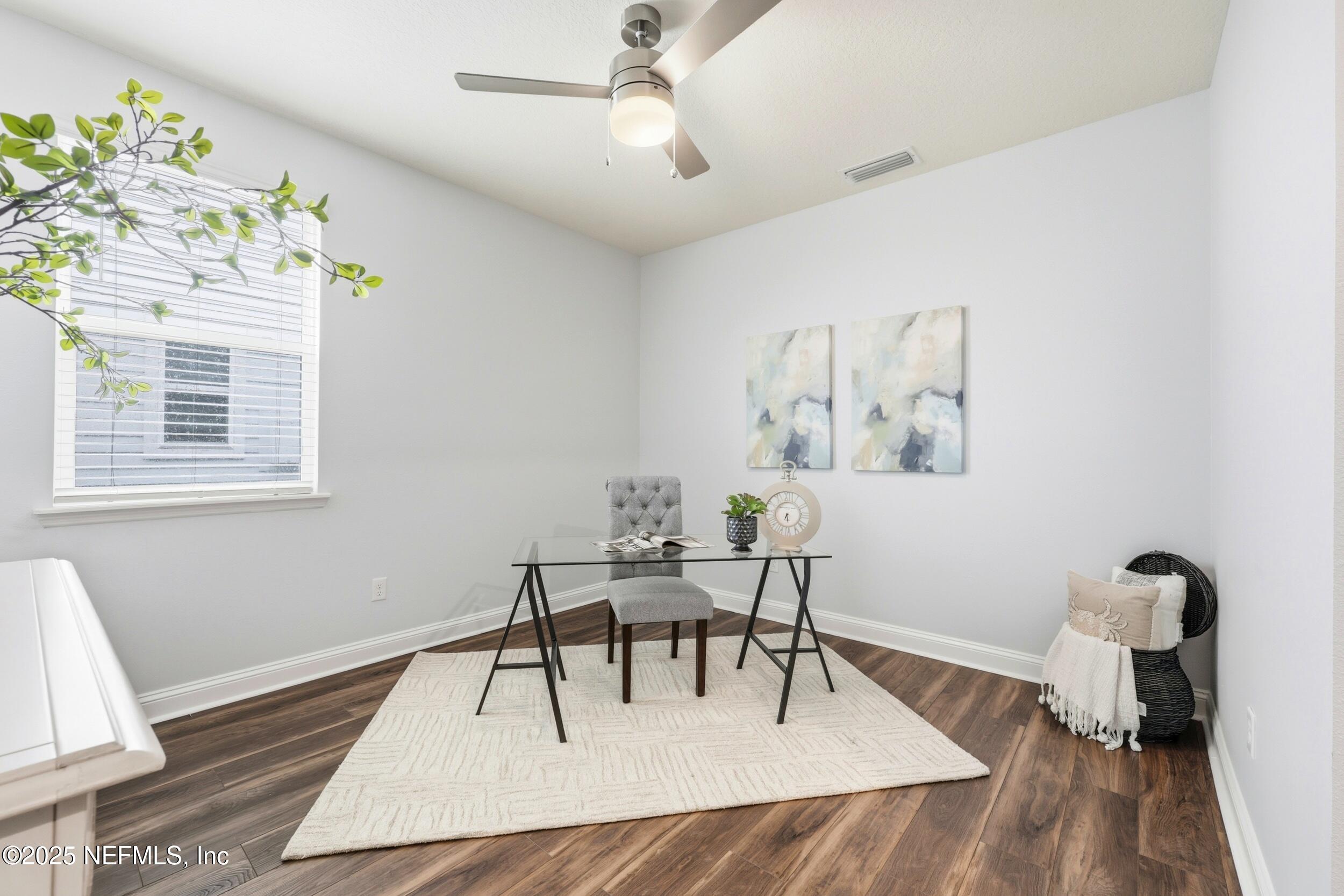 251 Rambling Brk Trail St. Johns, FL 32259 - Photo 20 of 40 a living room with furniture and a wooden floor