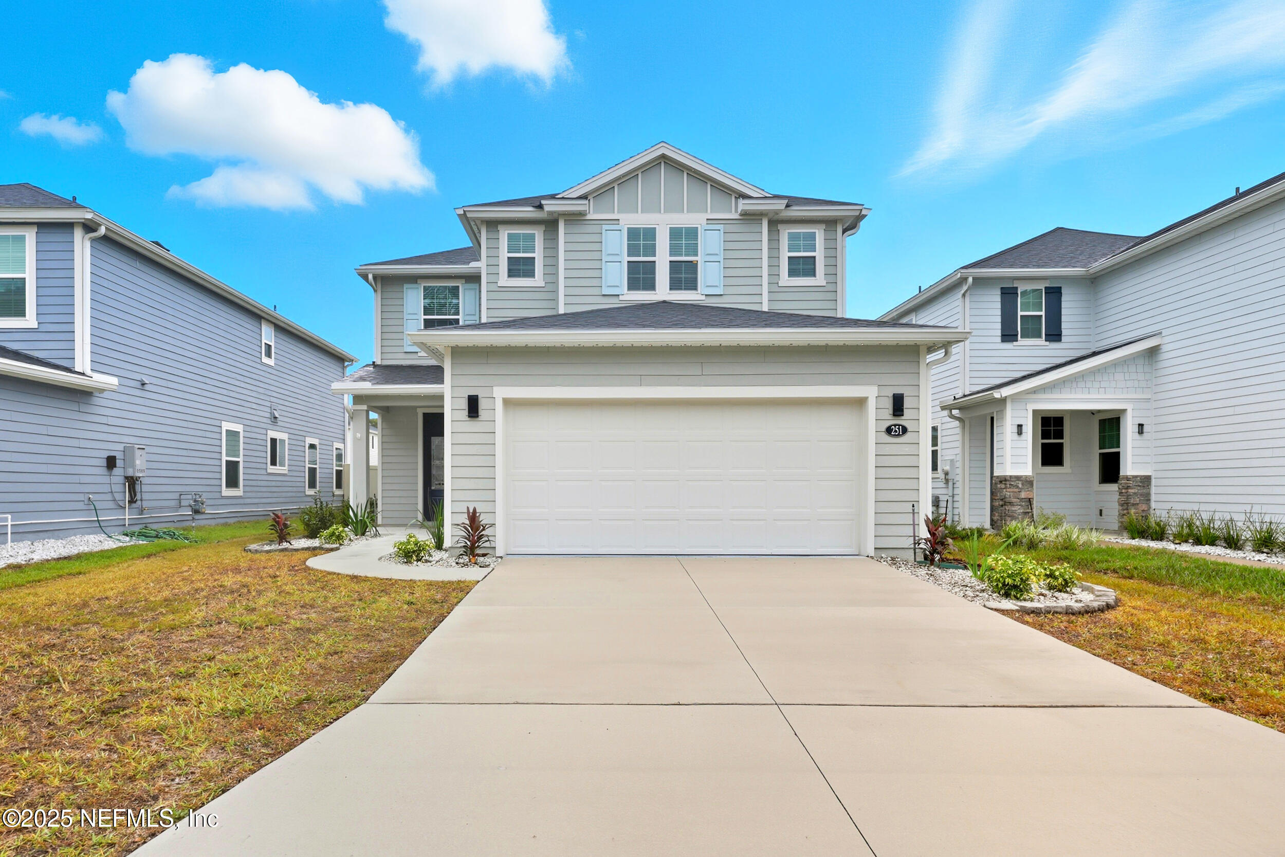 251 Rambling Brk Trail St. Johns, FL 32259 - Photo 2 of 40 a front view of a house with a yard and garage
