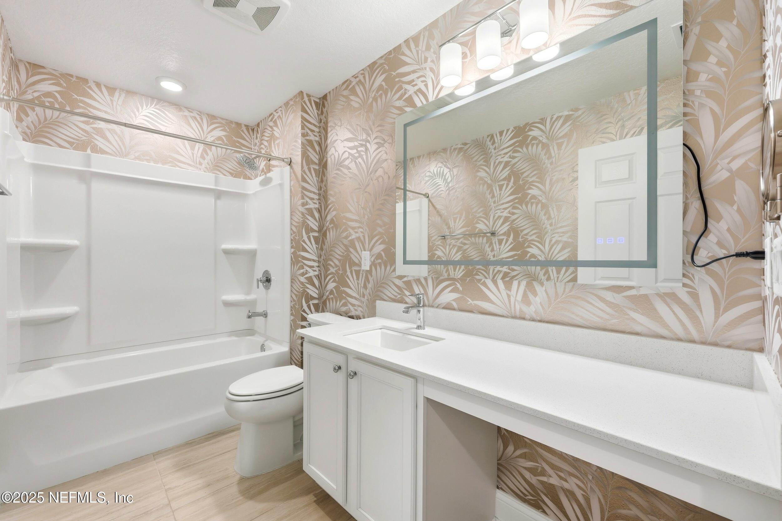 251 Rambling Brk Trail St. Johns, FL 32259 - Photo 34 of 40 a bathroom with a sink a toilet and a bathtub