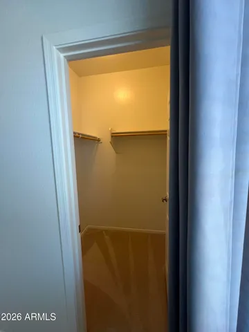 a view of empty room with a flat screen tv