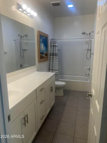 a view of hallway with furniture and a window