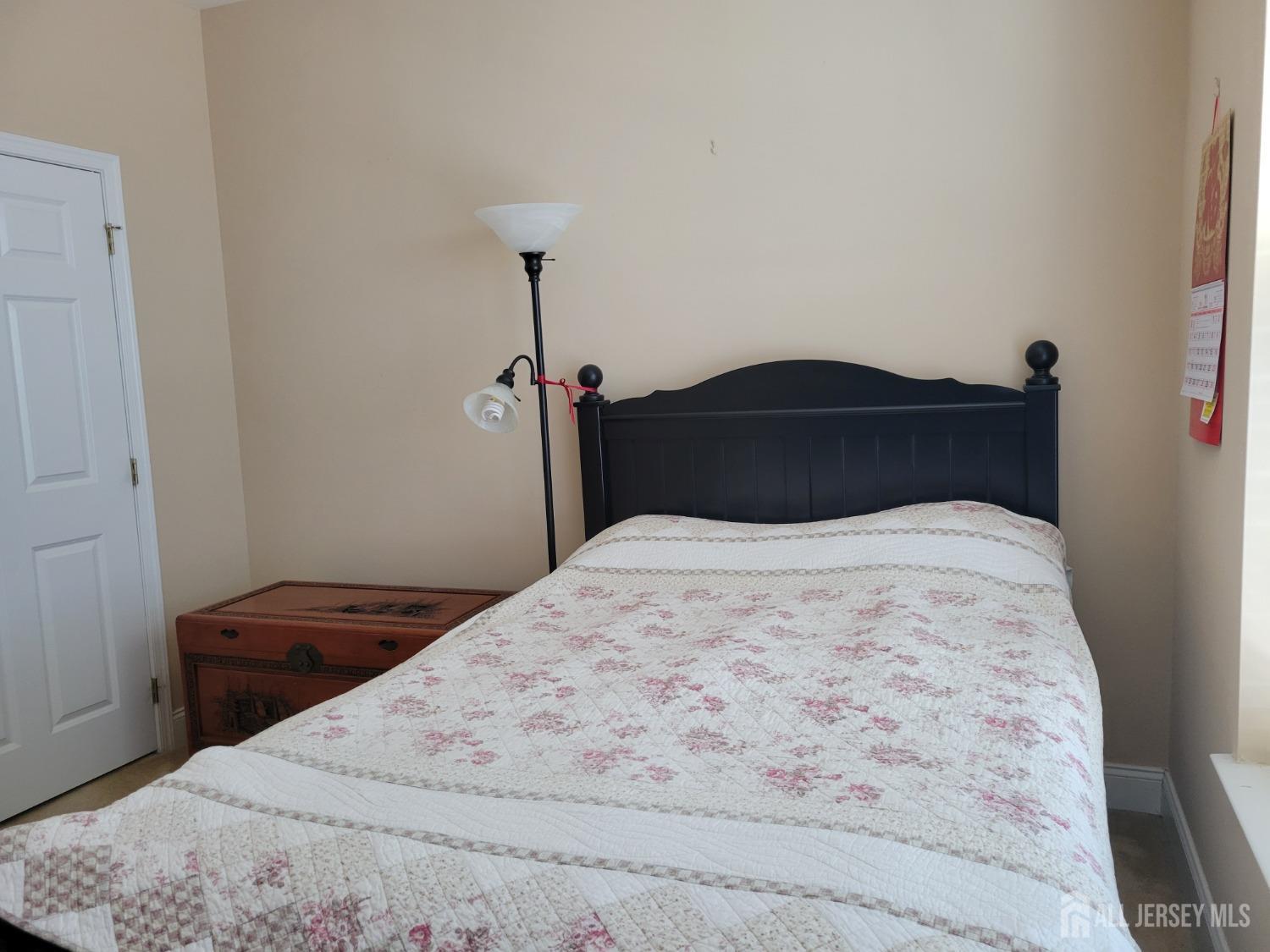 100 Middlesex Boulevard, Unit 341 Plainsboro, NJ 08536 - Photo 11 of 16 a bedroom with a bed and a dresser